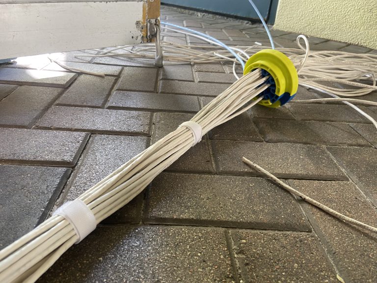 A wrap of CAT6 wires being cable combed and then velcro for a clean look