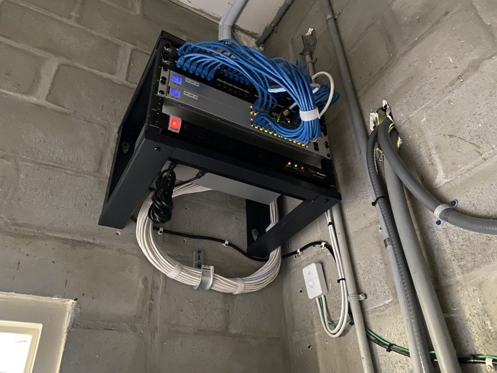 A medium size network rack with all of the wiring neat and clean