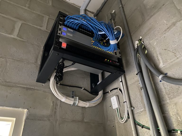 A medium size network rack with all of the wiring neat and clean